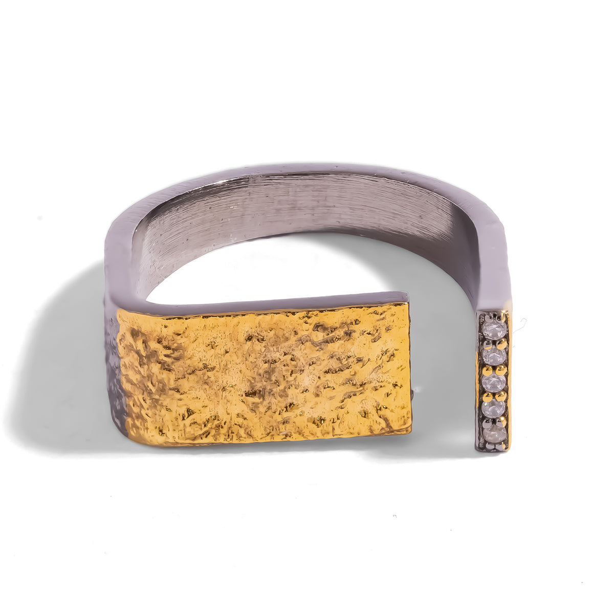 Golden Contrast Two Tone Statement Ring, front view of the textured gold panel and a vertical line of pave zircon on the gunmetal band