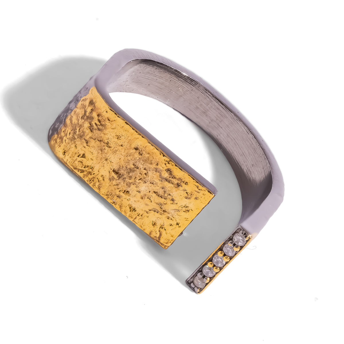 Golden Contrast Two Tone Statement Ring at an angle, open squared band in gunmetal with a hammered-look gold panel