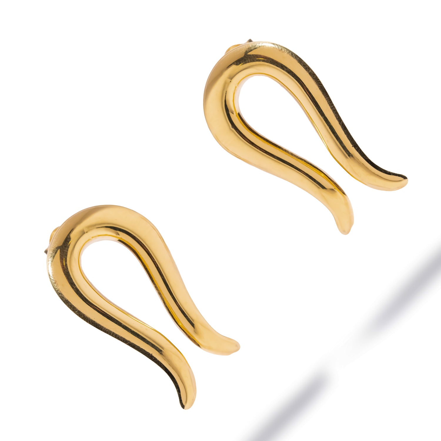 Golden Horseshoe Statement Stud Earrings laid flat in a diagonal pair composition, mirror-polished 24K gold plating