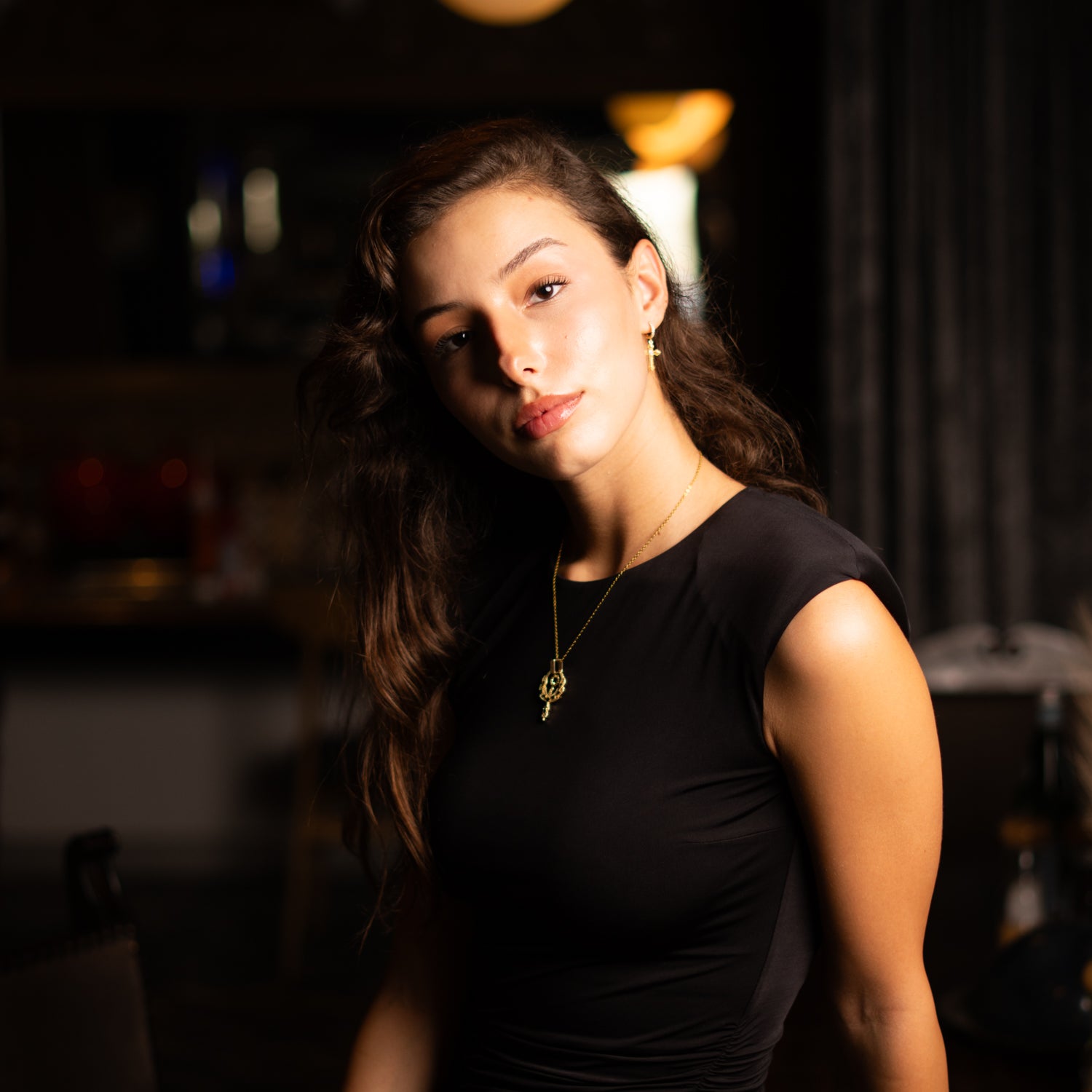 Golden phoenix pendant symbolizing strength and transformation