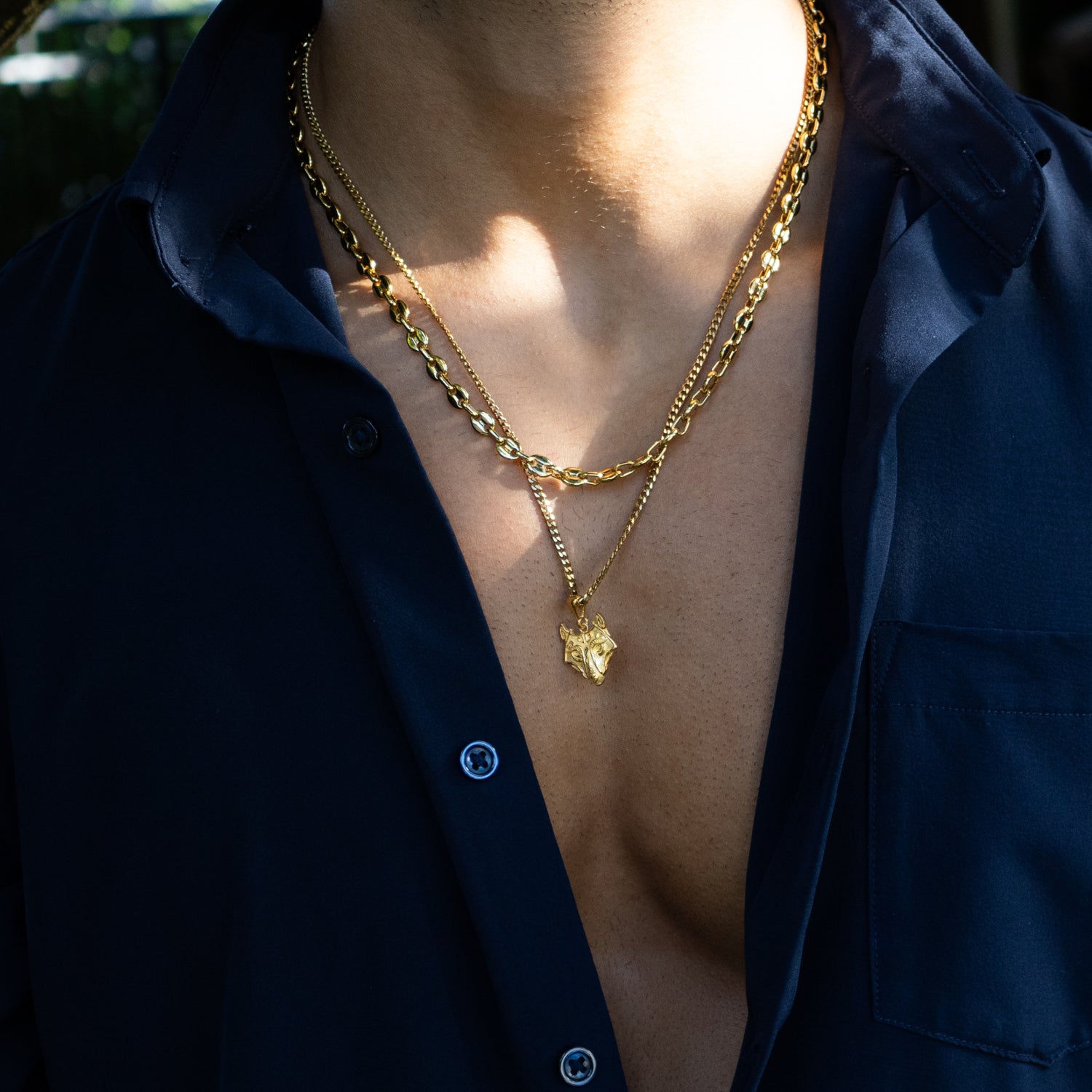 Golden wolf head pendant necklace in 925 sterling silver, 24k gold plating, detailed fur texture.