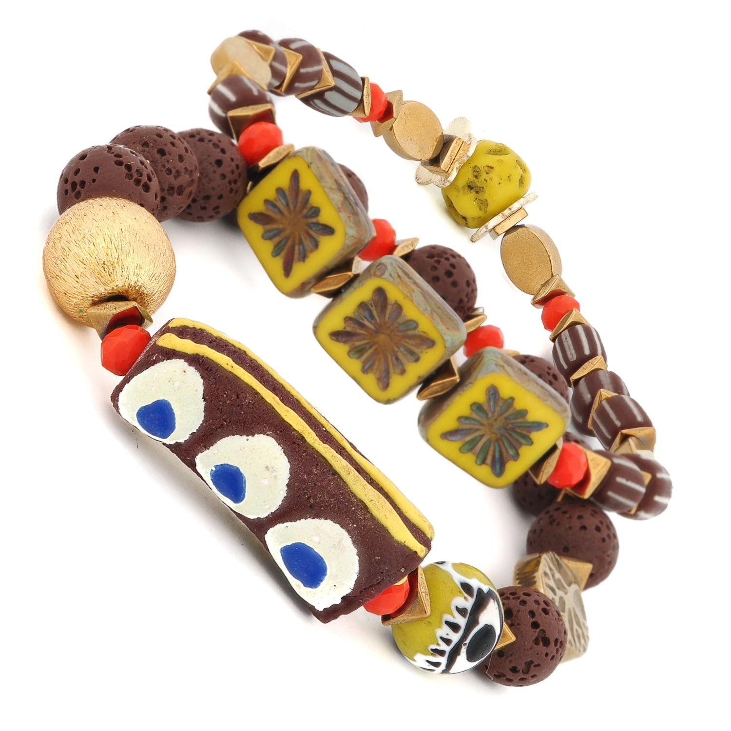 Grounded Spirit two-bracelet set with natural lava rock, gold hematite, and handcrafted ceramic evil eye focal beads — protective jewelry from Ebru
