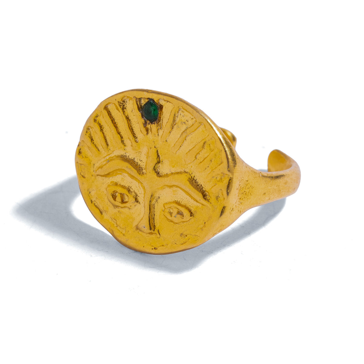 Guardian Emerald Eye Adjustable Gold Ring, front view of the carved guardian face with rays and an emerald at the crown