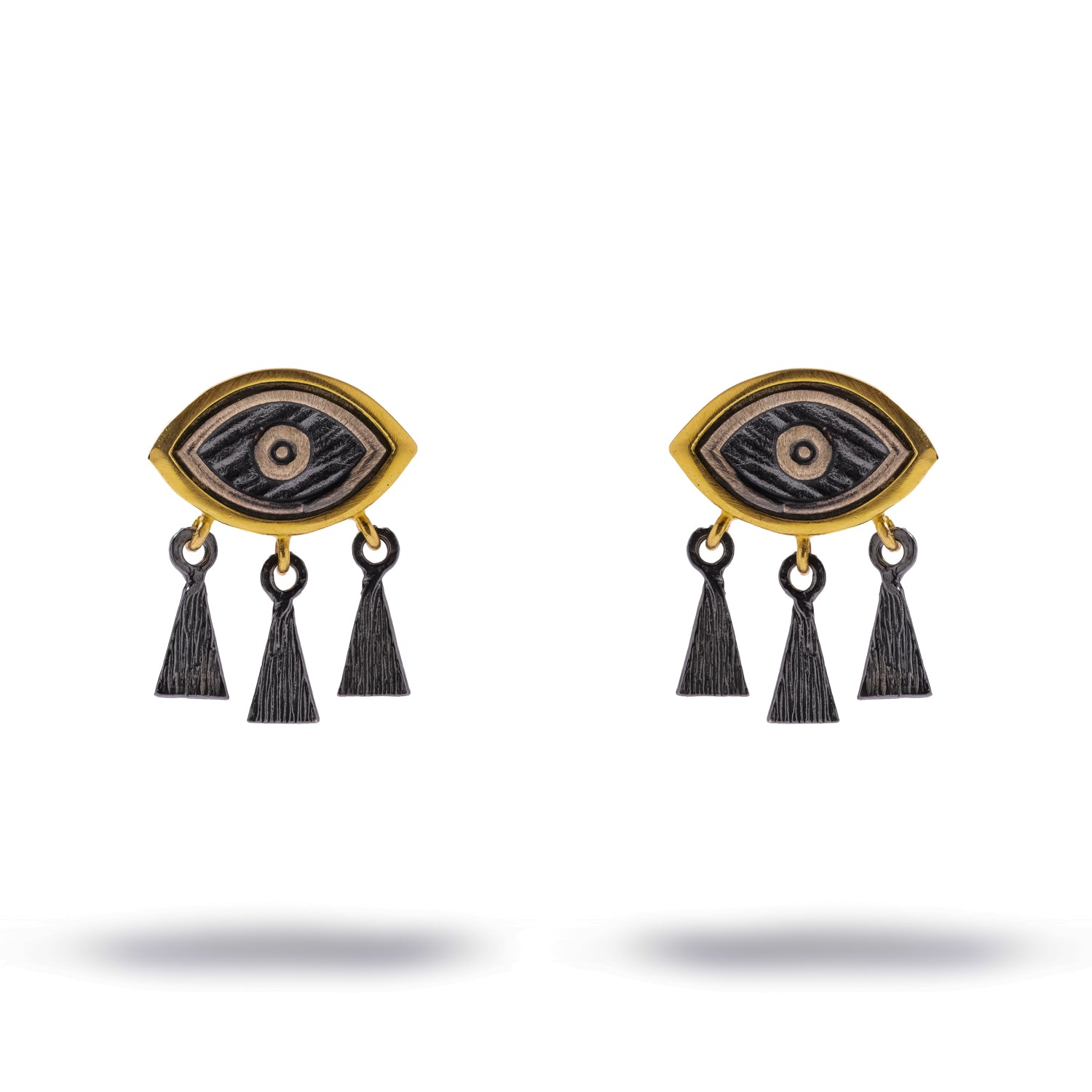 Guardian Eye Fringe Two-Tone Silver Stud Earrings laid flat, front view showing the gold-plated almond eye frame and three oxidised fringe charms