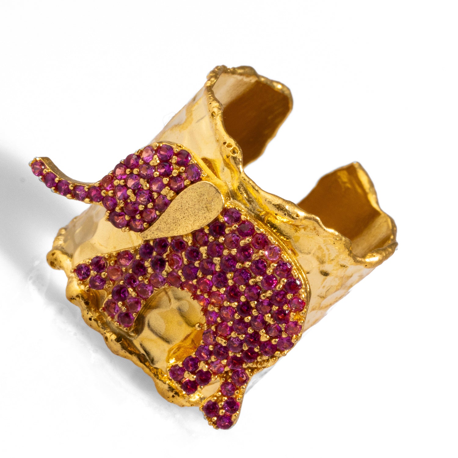 Elegant chunky gold ring with a pink crystal elephant design, crafted from 24k gold-plated brass, adjustable for versatile wear.
