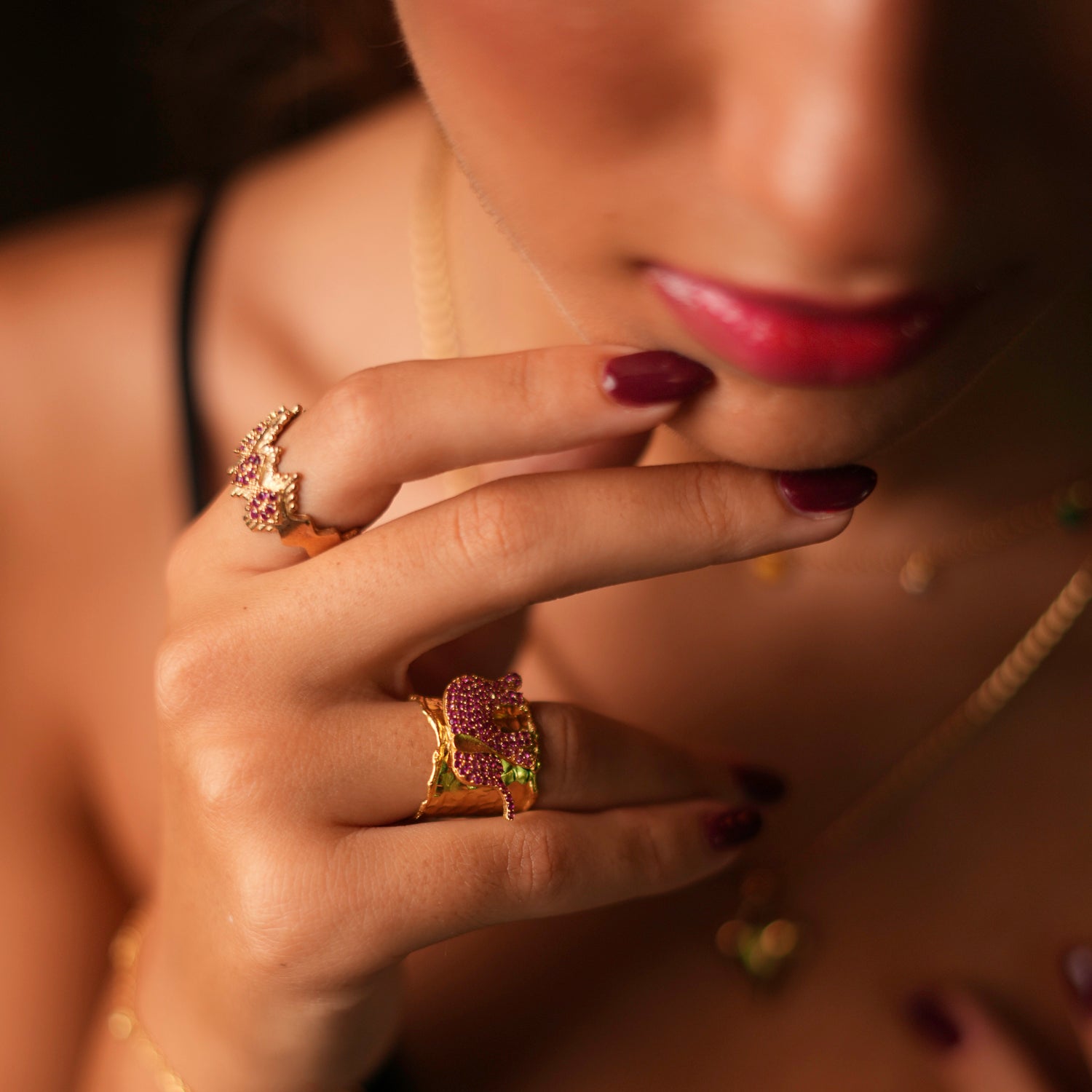 Statement ring featuring a lucky elephant with sparkling pink Swarovski crystals, set in 24k gold-plated brass with an adjustable band.
