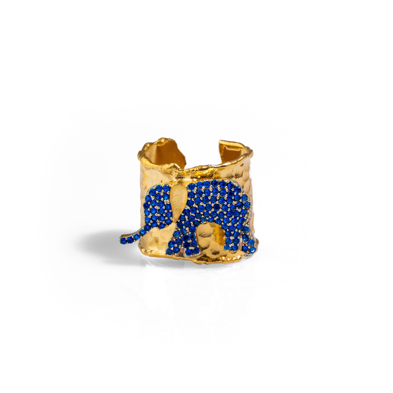 Gold chunky ring featuring a sapphire crystal elephant, crafted in 24k gold-plated brass with an adjustable band for a custom fit.
