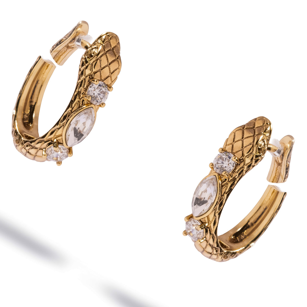 Serpent huggie hoop earrings at an angle, showing the scaled body curving around the hoop