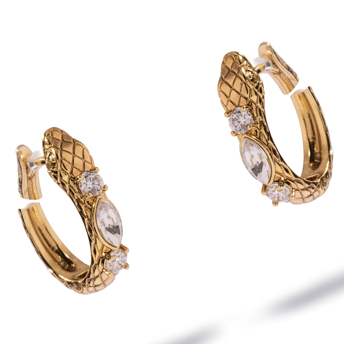 Serpent huggie hoop earrings angled to show the marquise zircon at the center of the spine