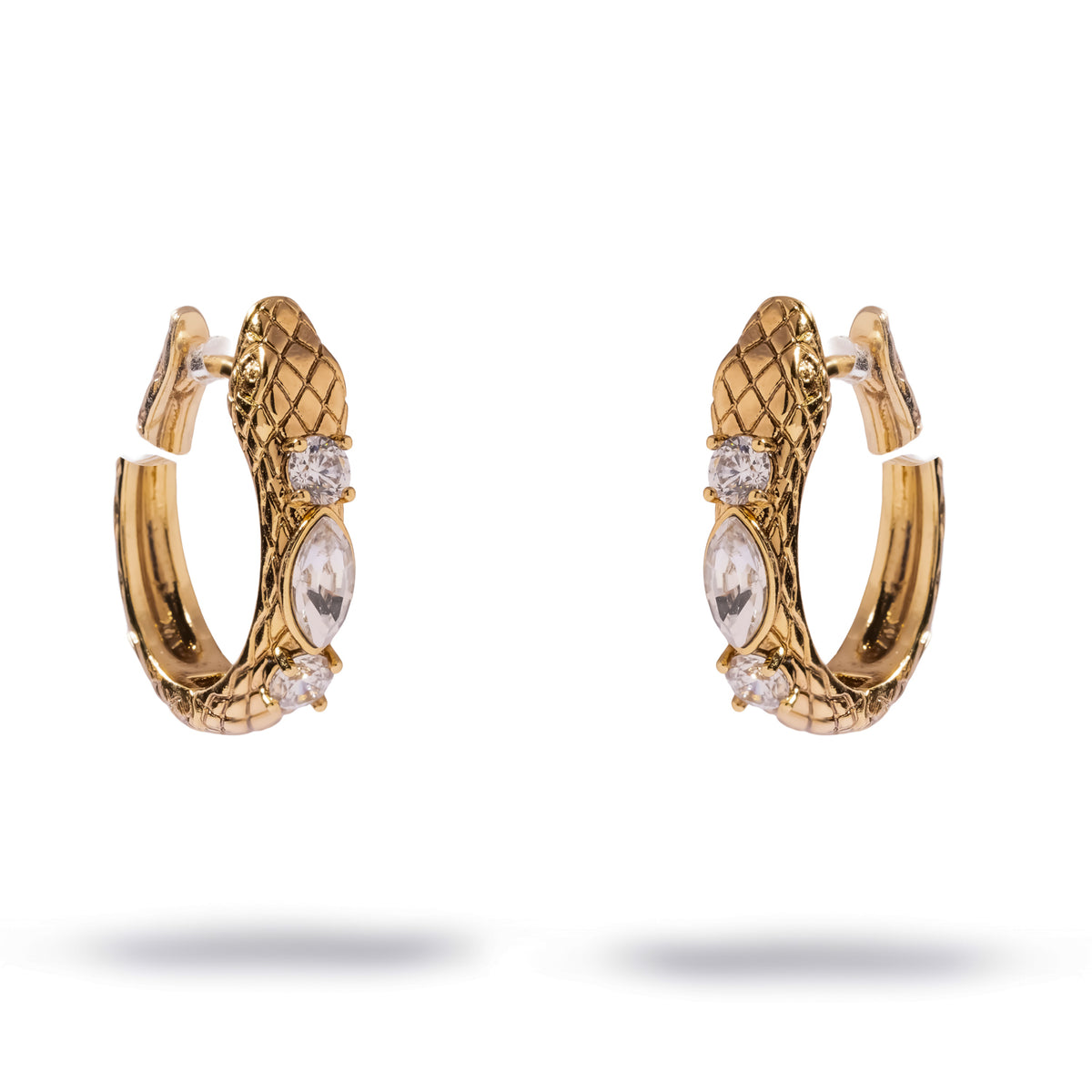 Gold huggie hoop earrings shaped as a coiled serpent with textured scales and three hand set zircon stones along the spine