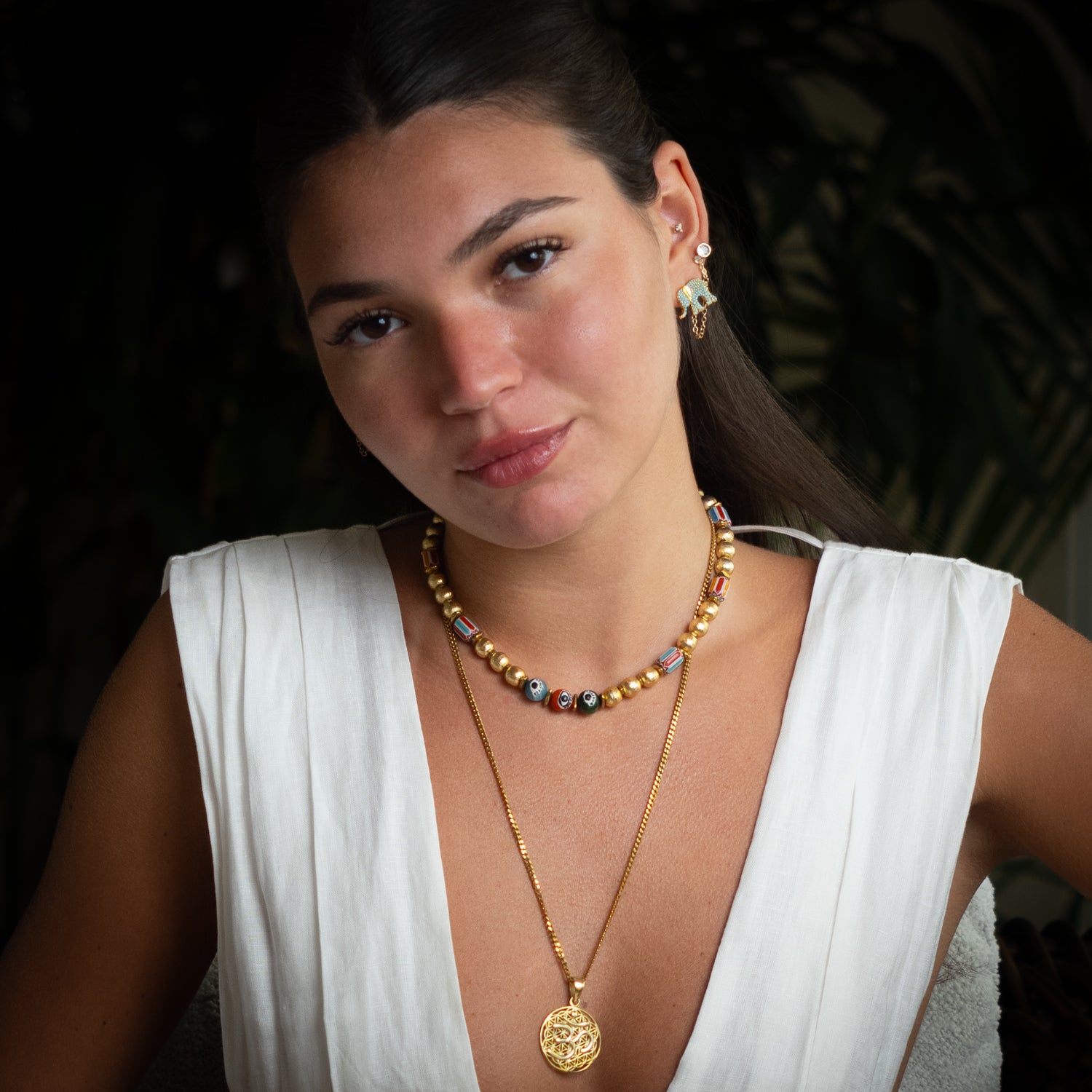 Guardian Turquoise Elephant gold stud earrings styled on model, summer talisman jewelry