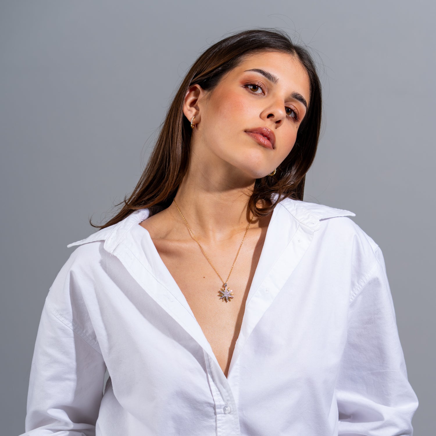 18k gold-plated guiding star pendant necklace with tiny CZ diamond accents on a fine gold chain.

