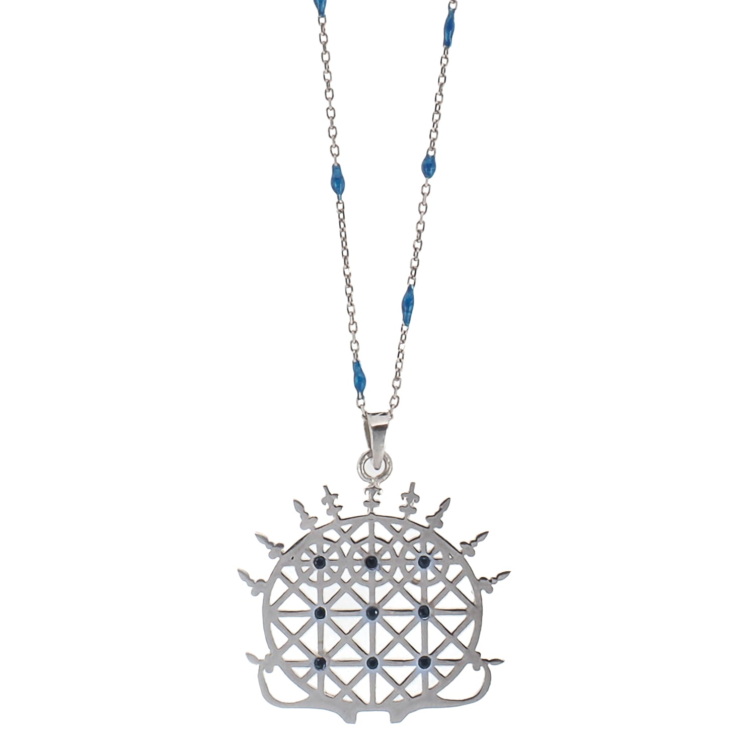The Hittite Sun Disk Necklace, featuring a sterling silver pendant adorned with lapis lazuli stones.