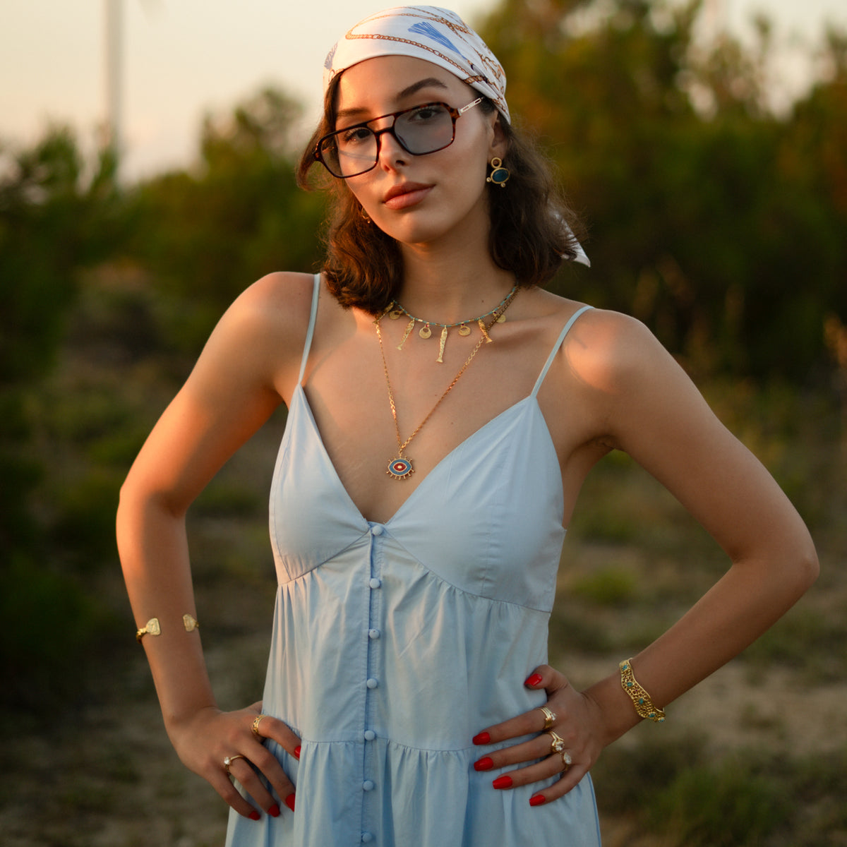 Full length view of a model wearing the Honeycomb Lace Turquoise &amp; Ruby Gold Cuff Bracelet with Ebru Jewelry necklaces and rings