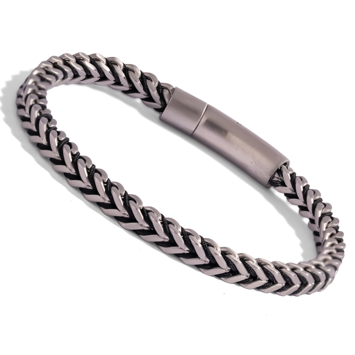 Silver tone stainless steel foxtail bracelet with jet black cord, seen at an angle on a white background