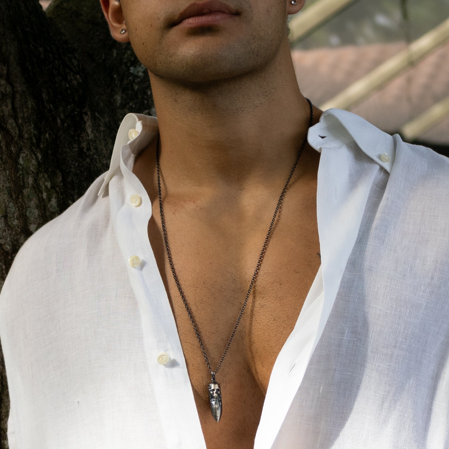 Masculine handcrafted sterling silver necklace, dark rhodium antique finish, skull and fang pendant, 26-inch chain.