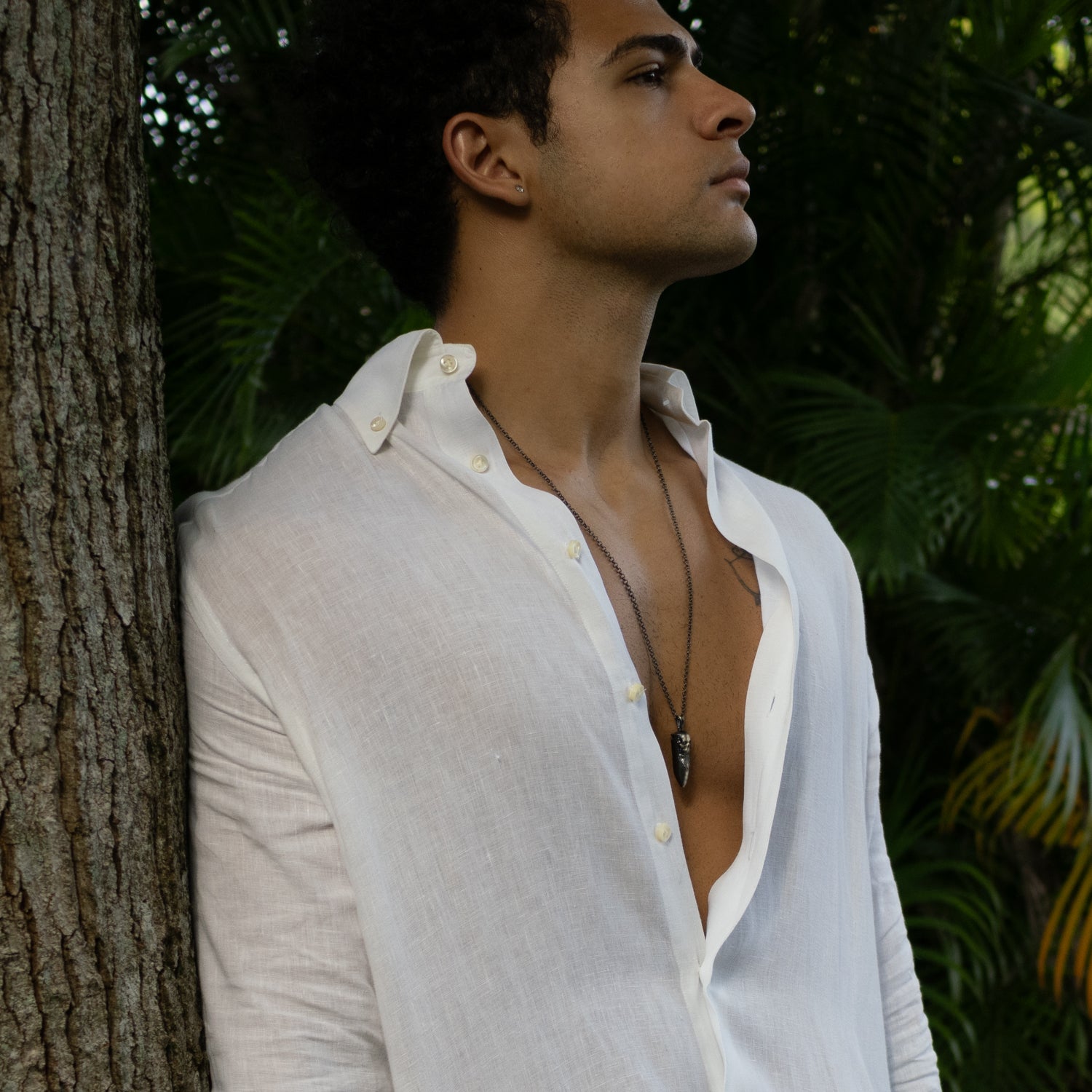 Handcrafted 925 sterling silver necklace with dark rhodium finish, skull and fang pendant, 26-inch chain.