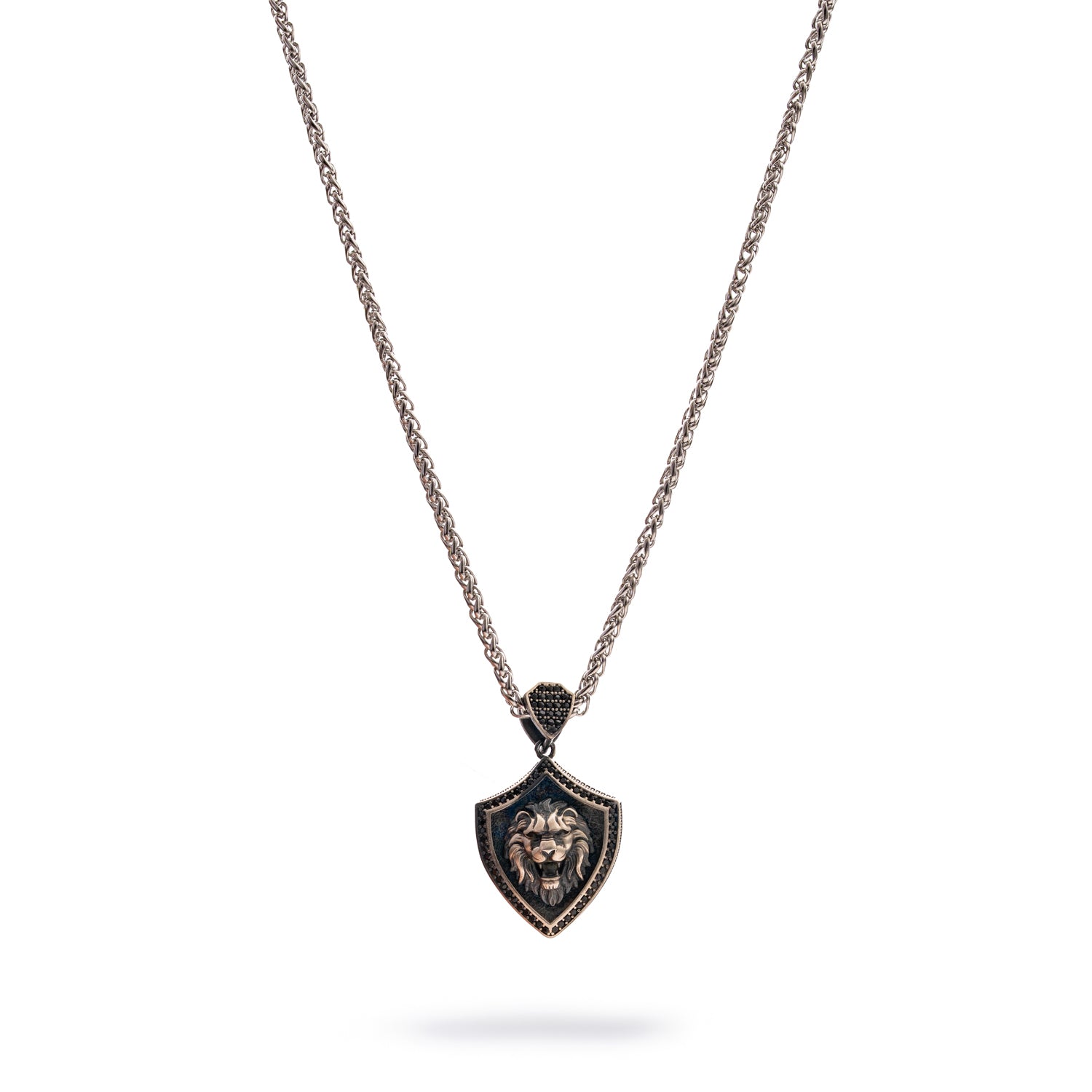 Sterling silver men’s necklace with shield-shaped pendant featuring a detailed lion head, rhodium finish, and polished chain.