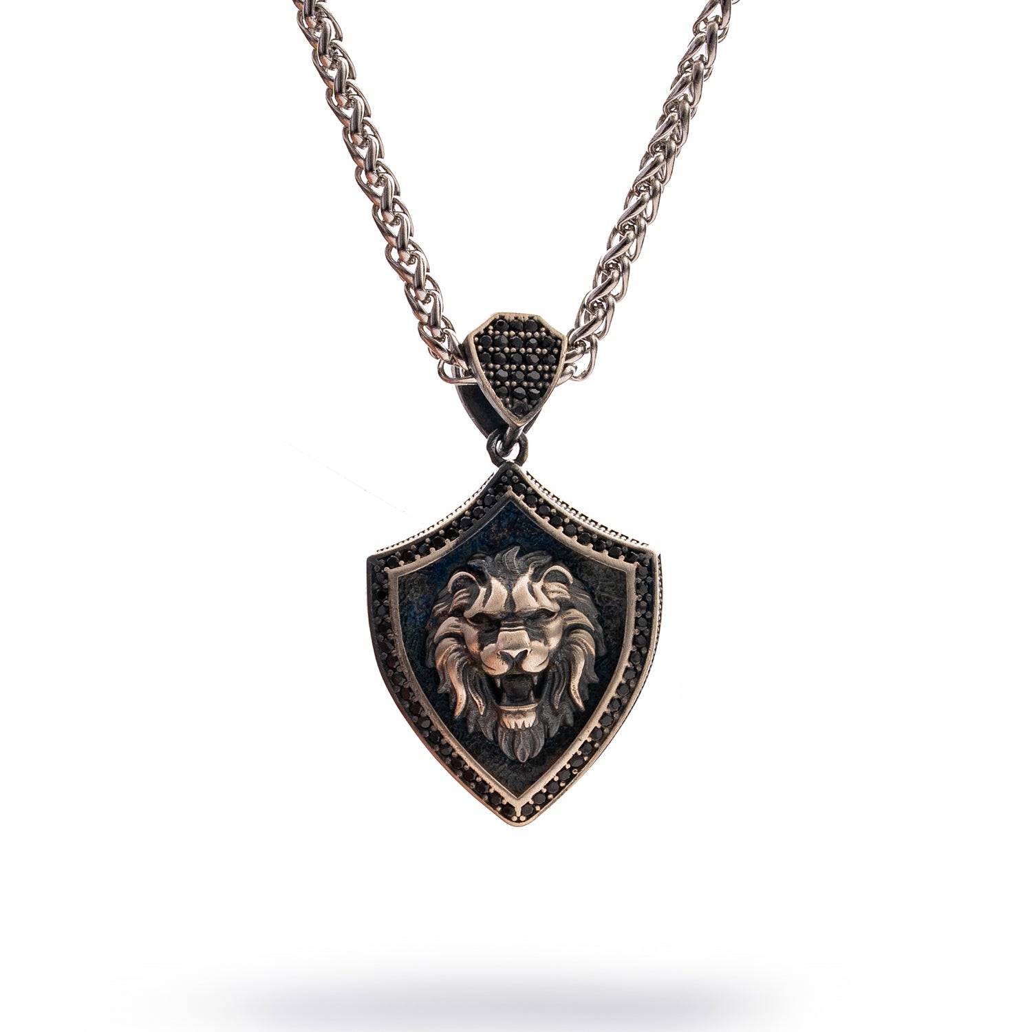 Lionhead shield men’s necklace in sterling silver with rhodium finish, intricate lion motif pendant, bold masculine jewelry.