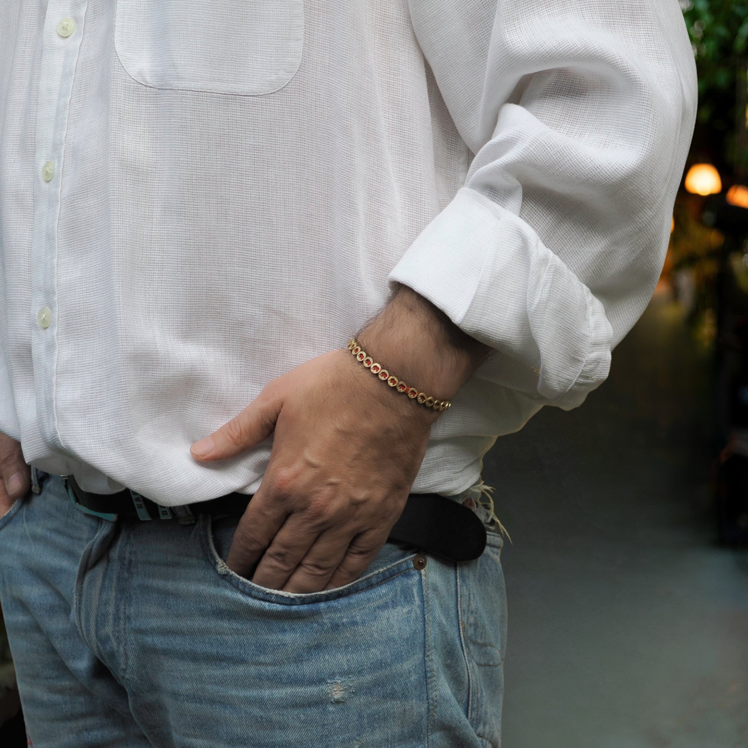 Handmade unisex bracelet with red rope and 18K gold-plated brass elephant charms for good fortune.
