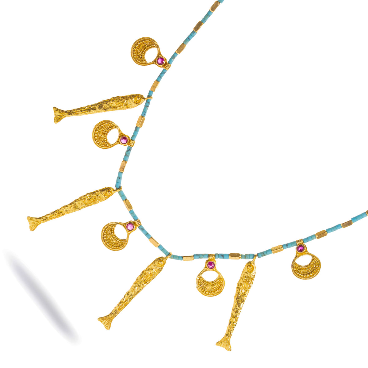 Angled studio view of the Lucky Fish necklace, the textured gold fish alternating with granulated crescent charms
