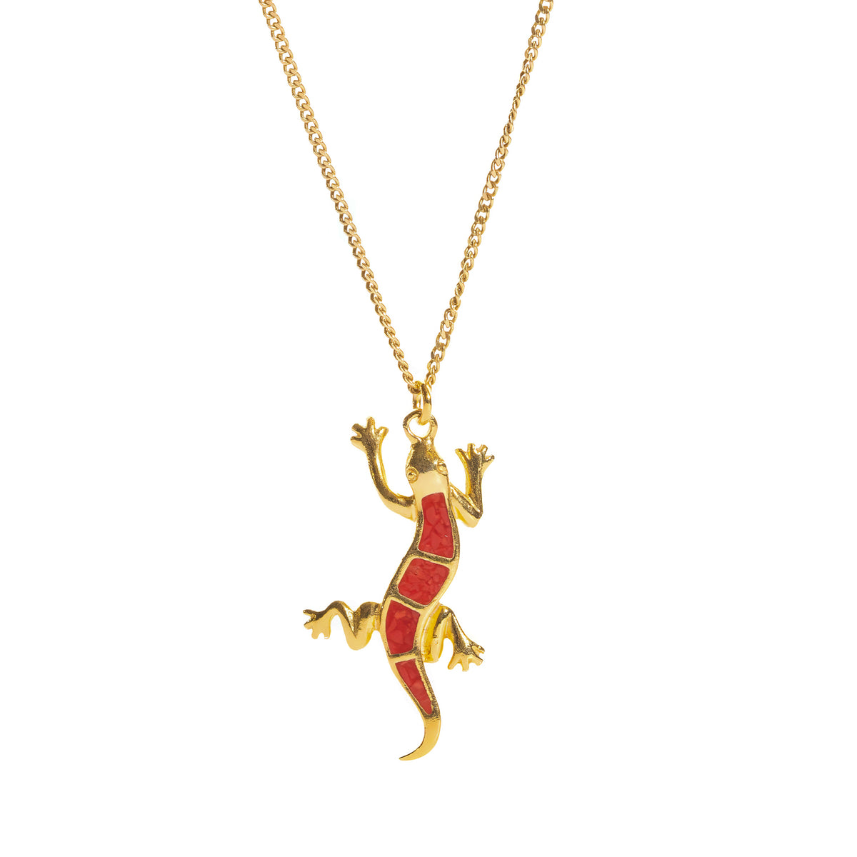 Close front view of the gold gecko pendant showing four red enamel panels framed by raised gold