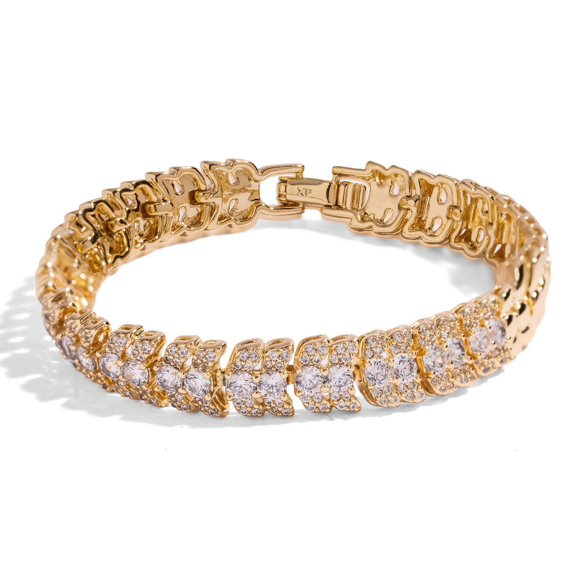Close view of the Luminous Halo gold tennis bracelet showing the fold over clasp and zircon links