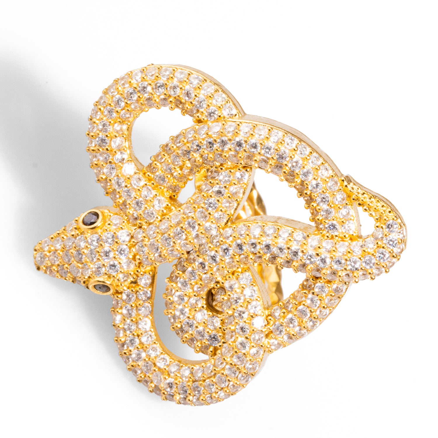 Captivating snake-shaped ring with CZ diamonds and green eyes, made from 24k gold-plated brass, featuring a chunky design and adjustable band.
