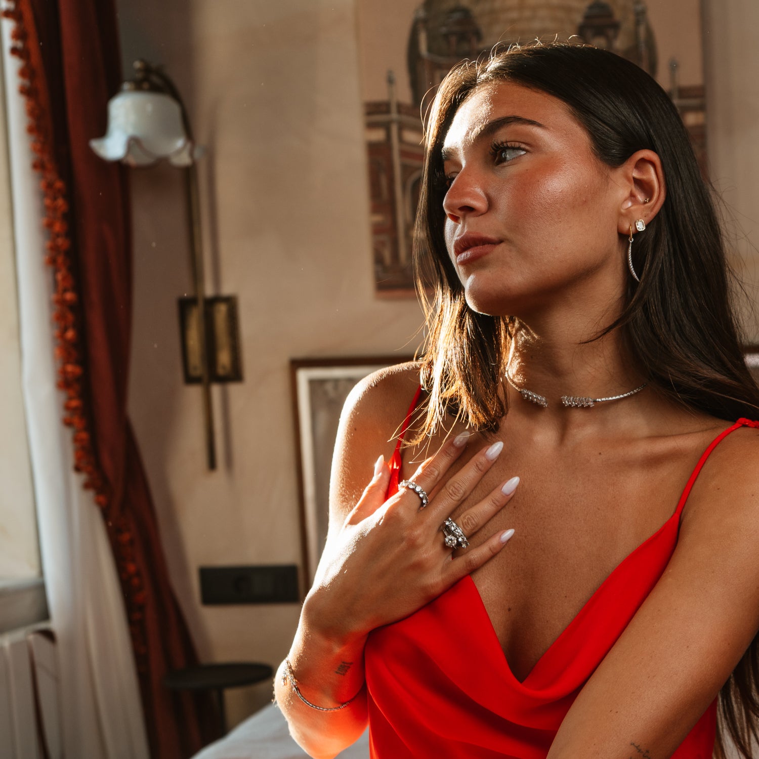 Model in red wearing a hand woven silver collar necklace with an open front