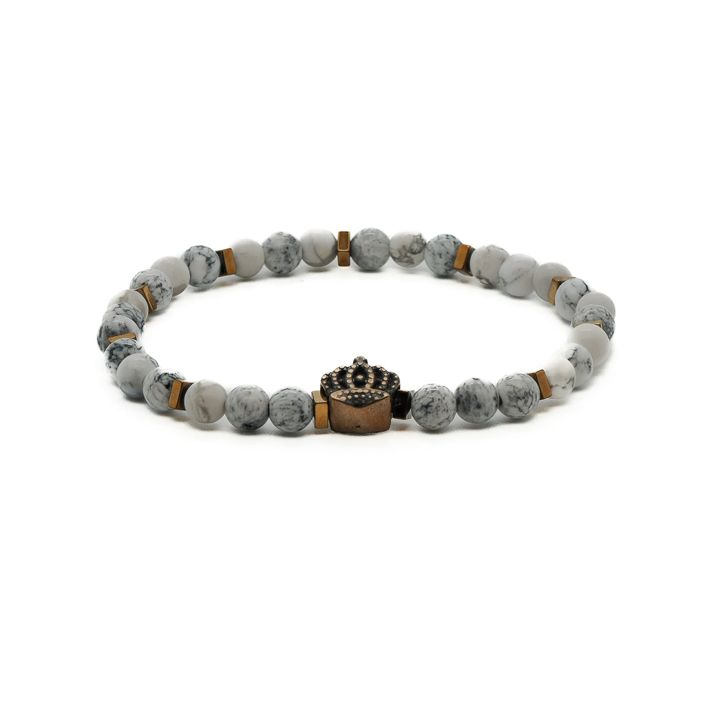 Explore the serene beauty of the Men&#39;s Spiritual Beaded Bracelet, featuring white howlite stone and a bronze crown accent bead.