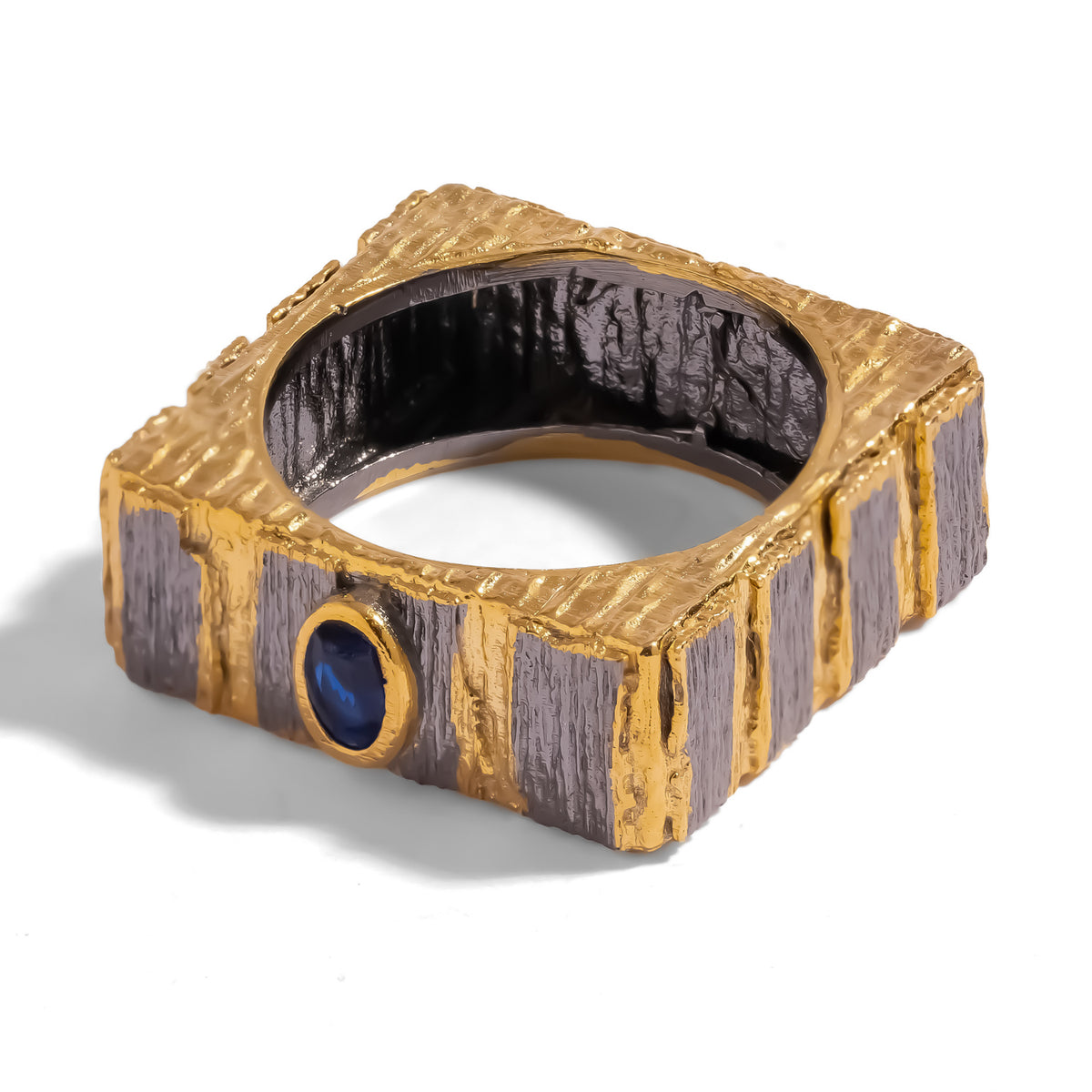 Midnight Temple Blue Sapphire Two-Tone Statement Ring, squared band with raised gold ridges, gunmetal panels and an oval blue sapphire