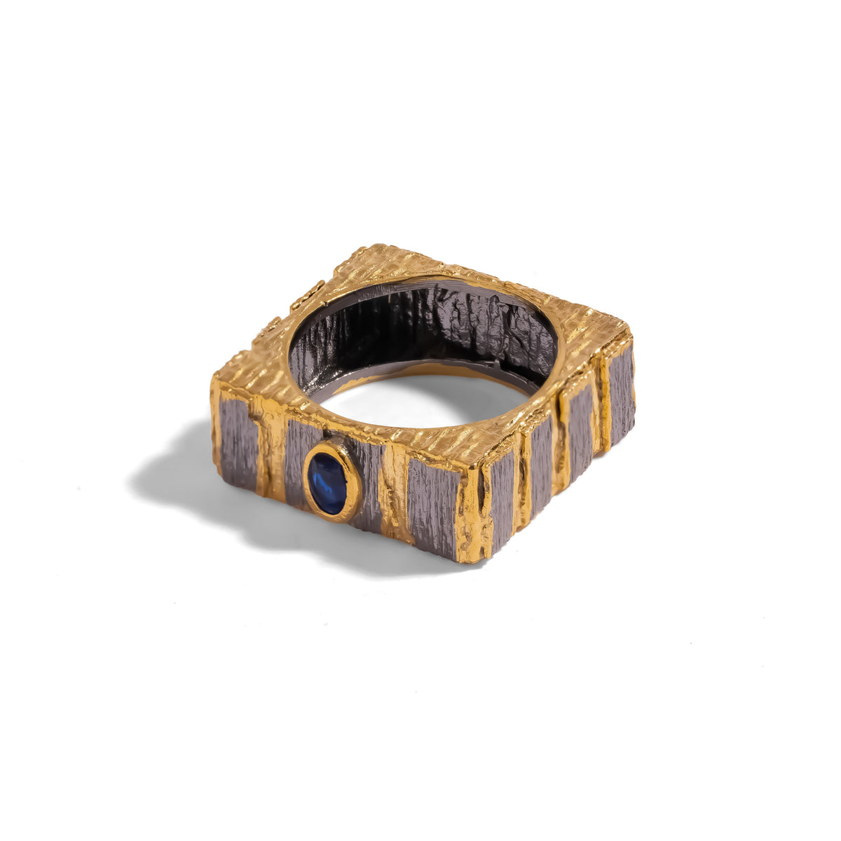 Midnight Temple Blue Sapphire Two-Tone Statement Ring on white, square silhouette and textured gunmetal interior