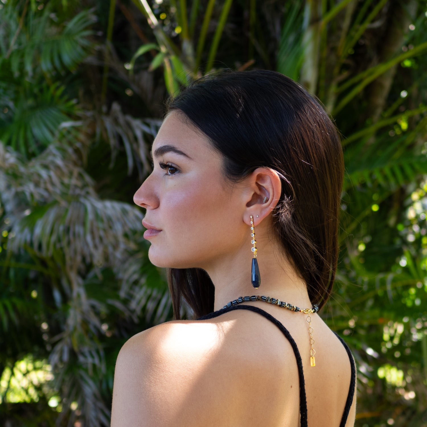 Close-up of elegant drop earrings symbolizing intuition, grounding, and spiritual depth

