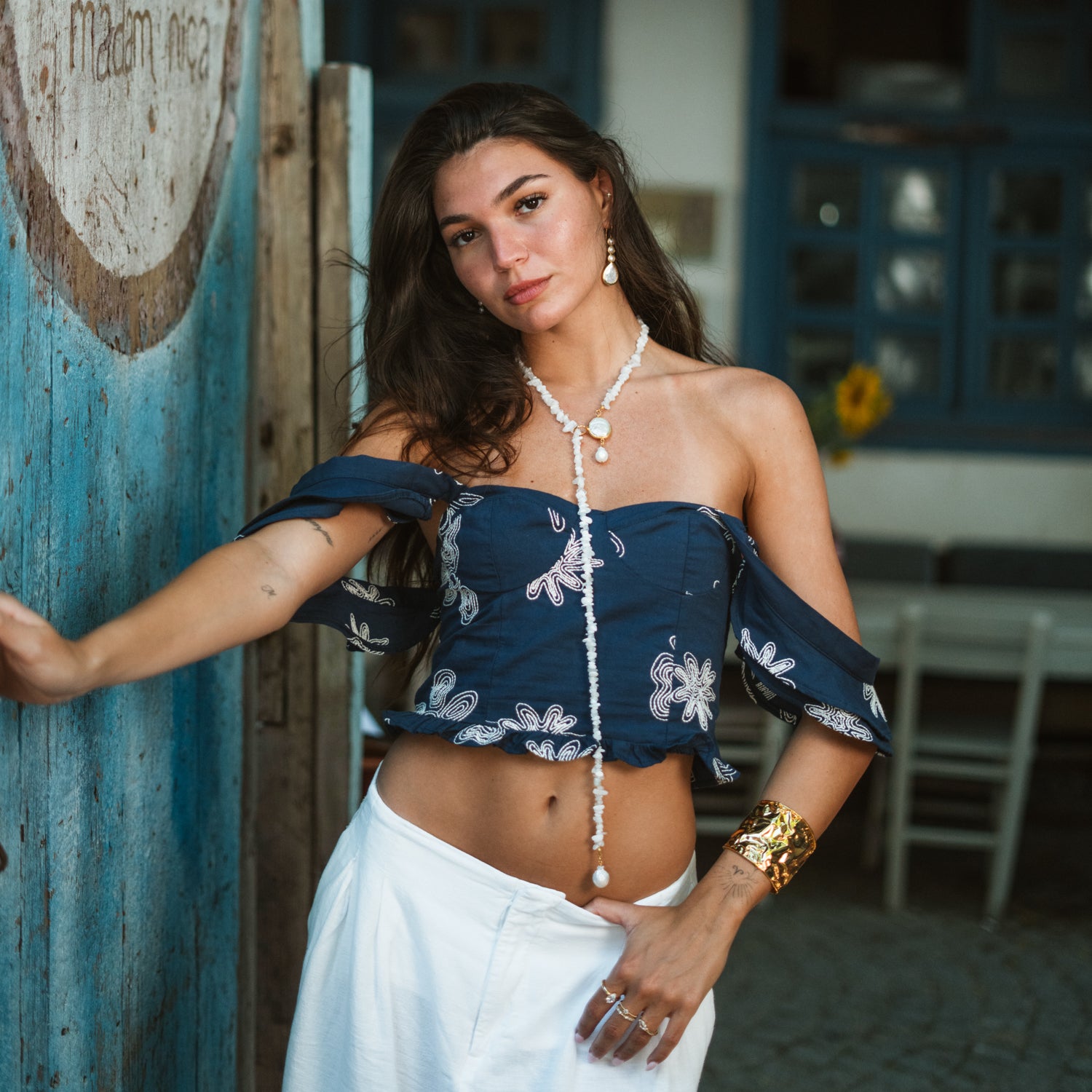 Full length view of the moonstone quartz pearl lariat necklace worn long, draping from the collarbone to the waist in a boho outfit