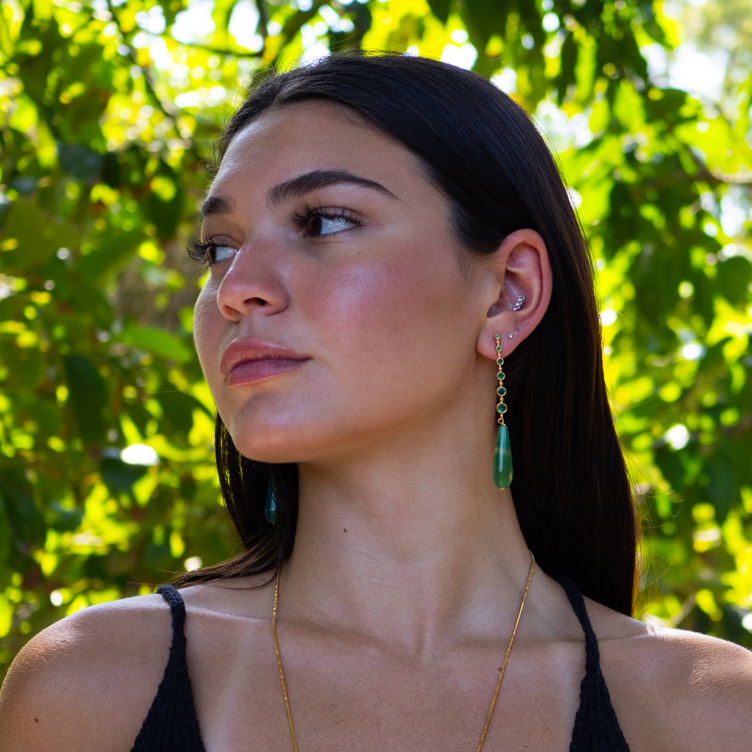 Handmade bohemian earrings featuring green jade stones and sparkling crystal accents

