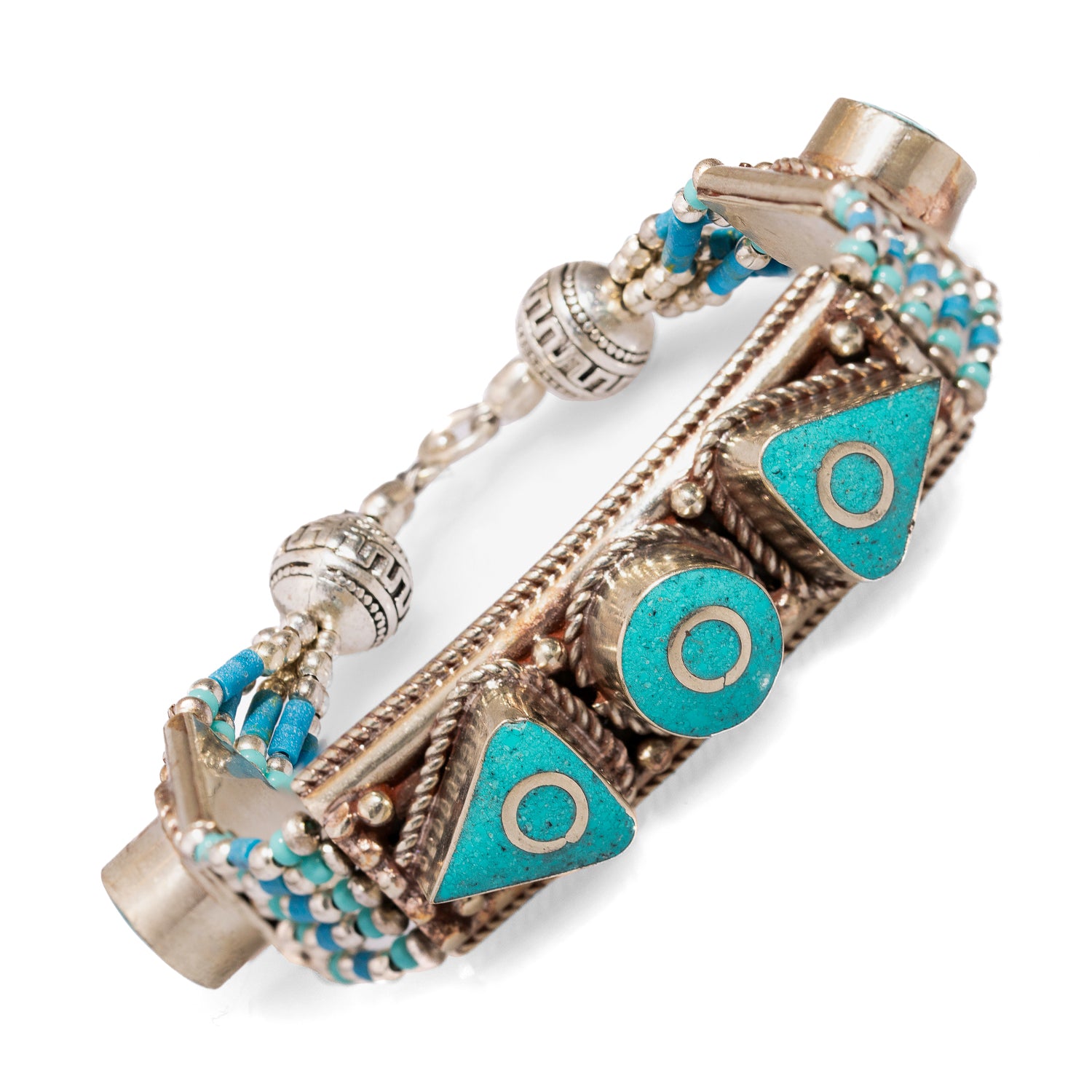 Artistic bohemian bracelet crafted from Nepalese silver, adorned with vibrant turquoise inlays.
