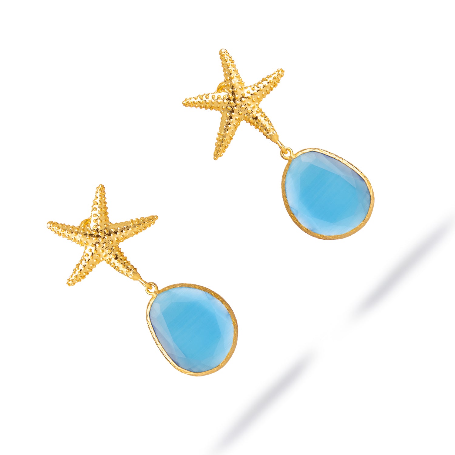 Handcrafted star earrings with dangling blue cat eye stone