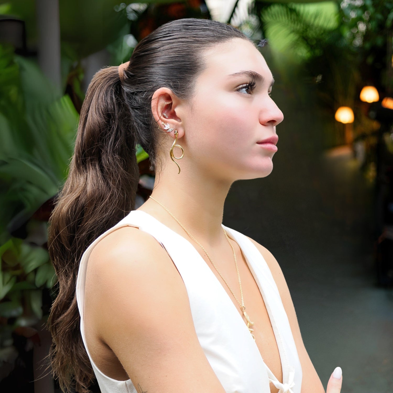 Onyx Eyed Serpent Earrings with luxurious 24K gold plating and an elegant snake-inspired design.
