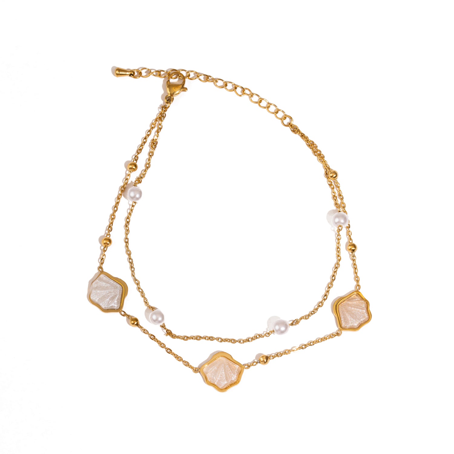 Adjustable gold anklet featuring freshwater pearls and ocean motifs