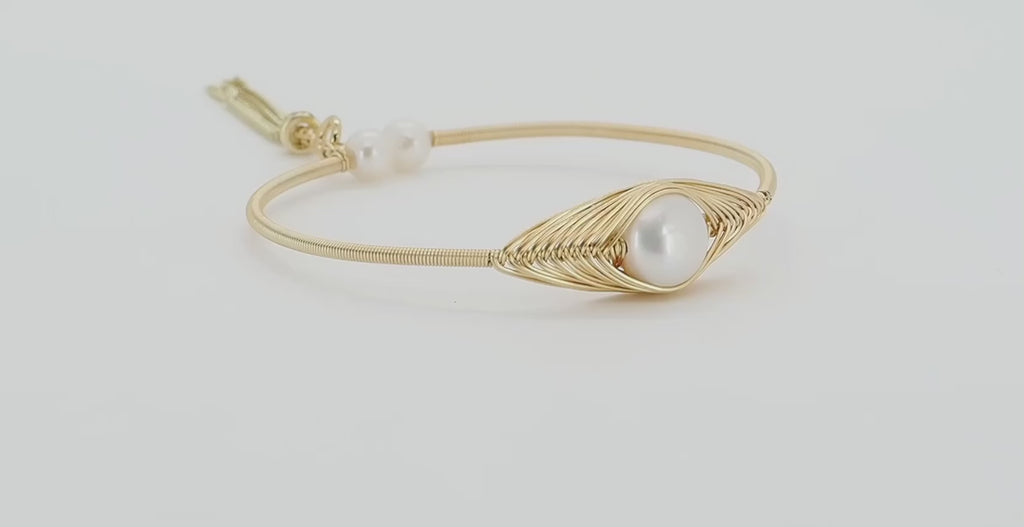 Adjustable and luxurious: Cleopatra Gold and Pearl Bangle Bracelet.