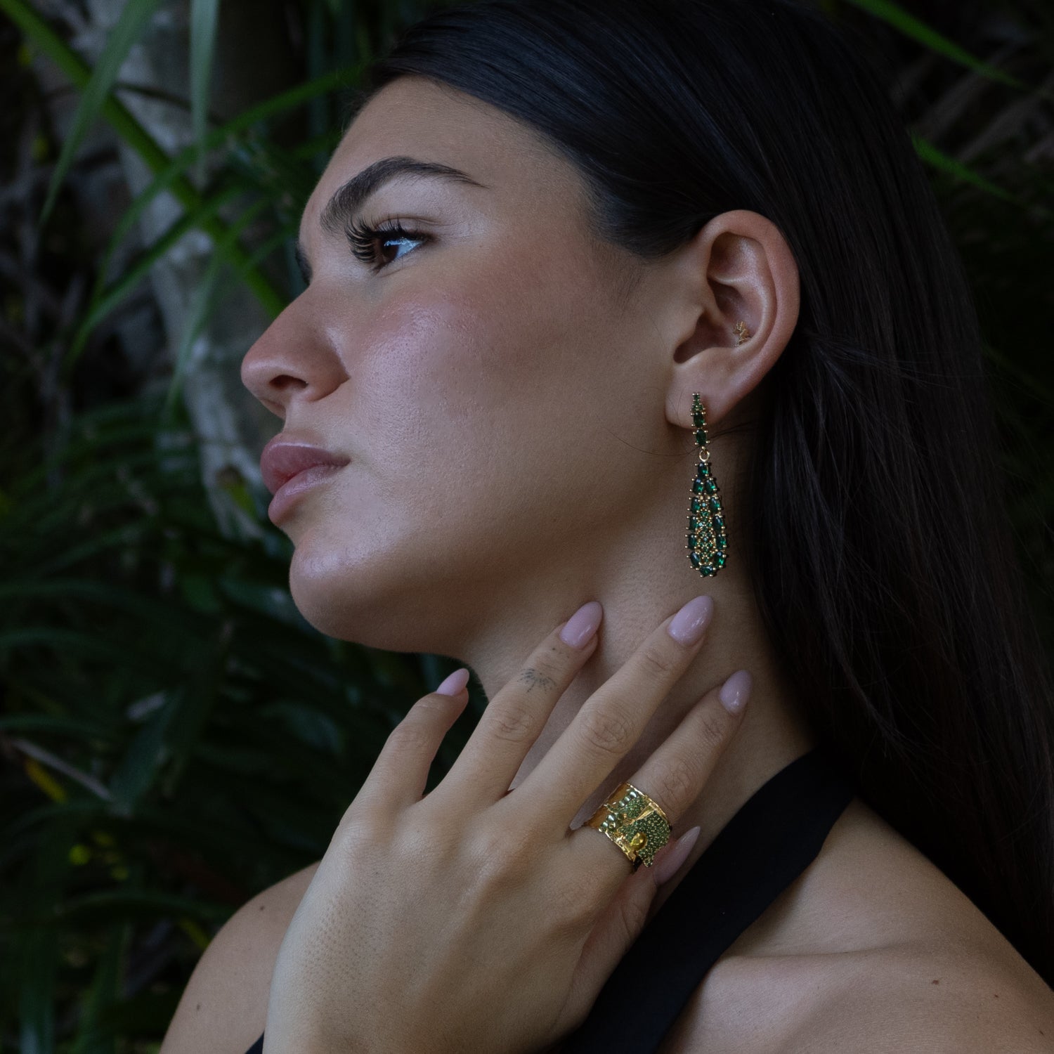 18k gold-plated bronze drop earrings with vibrant emerald crystals, regal-inspired design, and elegant handcrafted detailing.