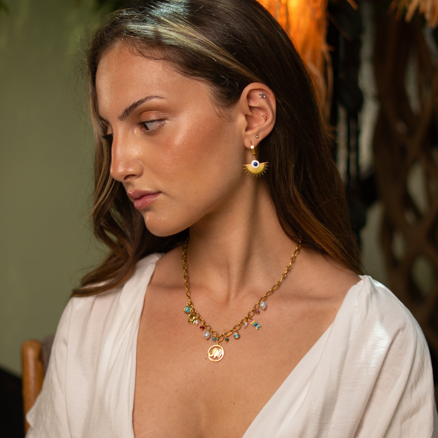 Gold stainless steel evil eye earrings with hoop closure