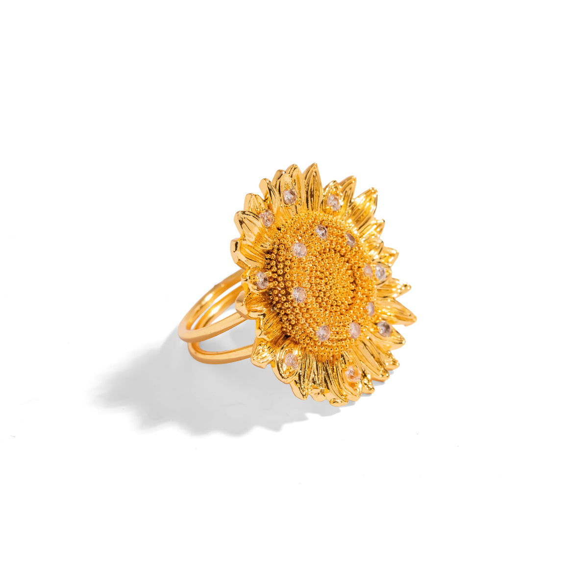 Studio view of the gold sunflower statement ring with its granulated center and cubic zirconia detailing