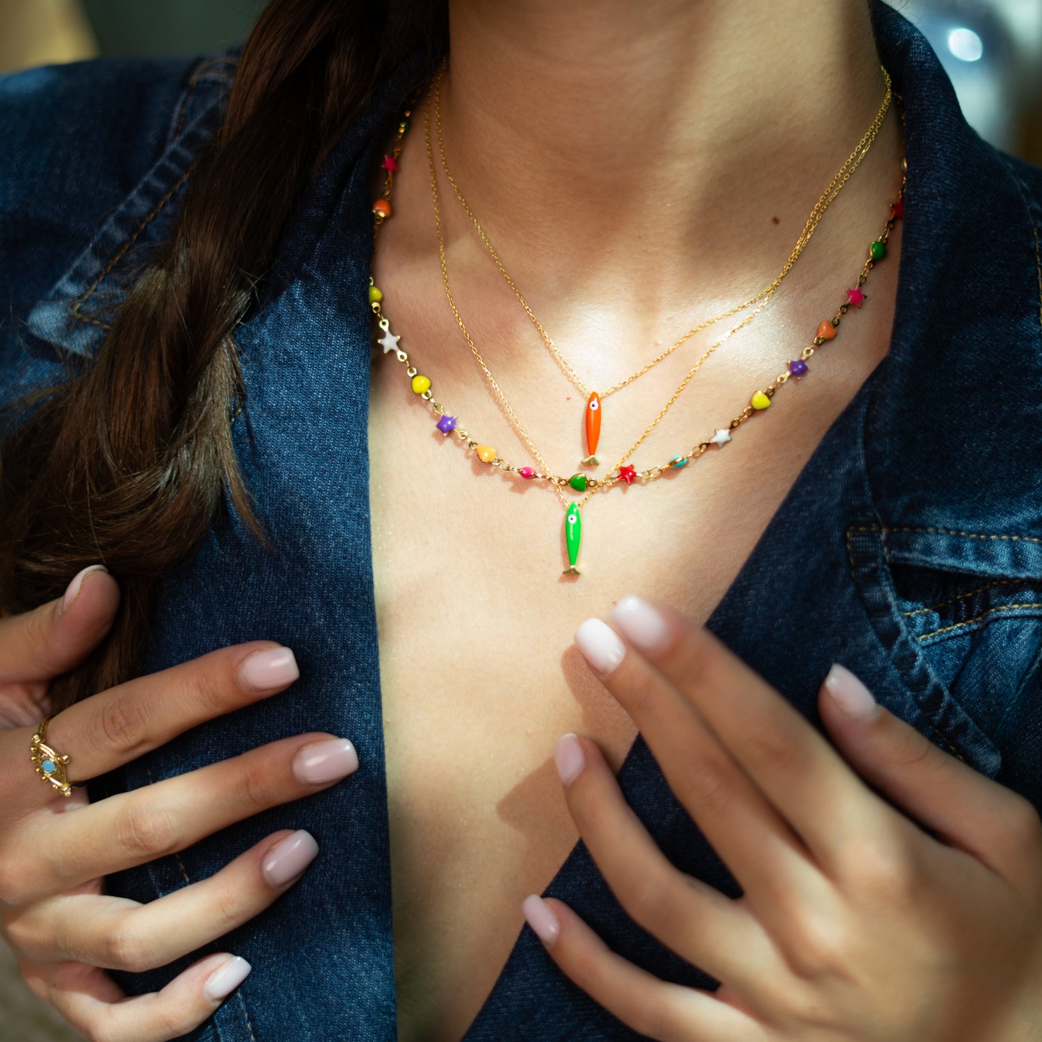 Colorful celestial-inspired choker with enamel hearts and stars on a water-resistant gold chain