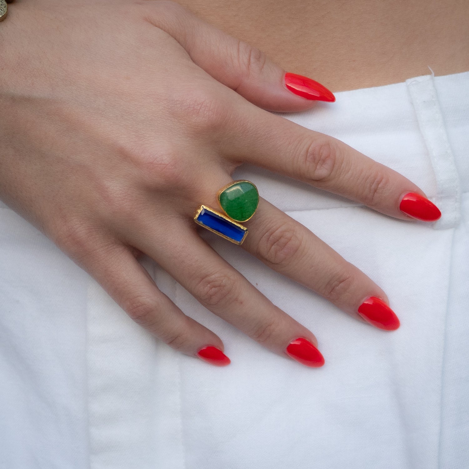 Handmade bold statement ring featuring rich sapphire and emerald stones

