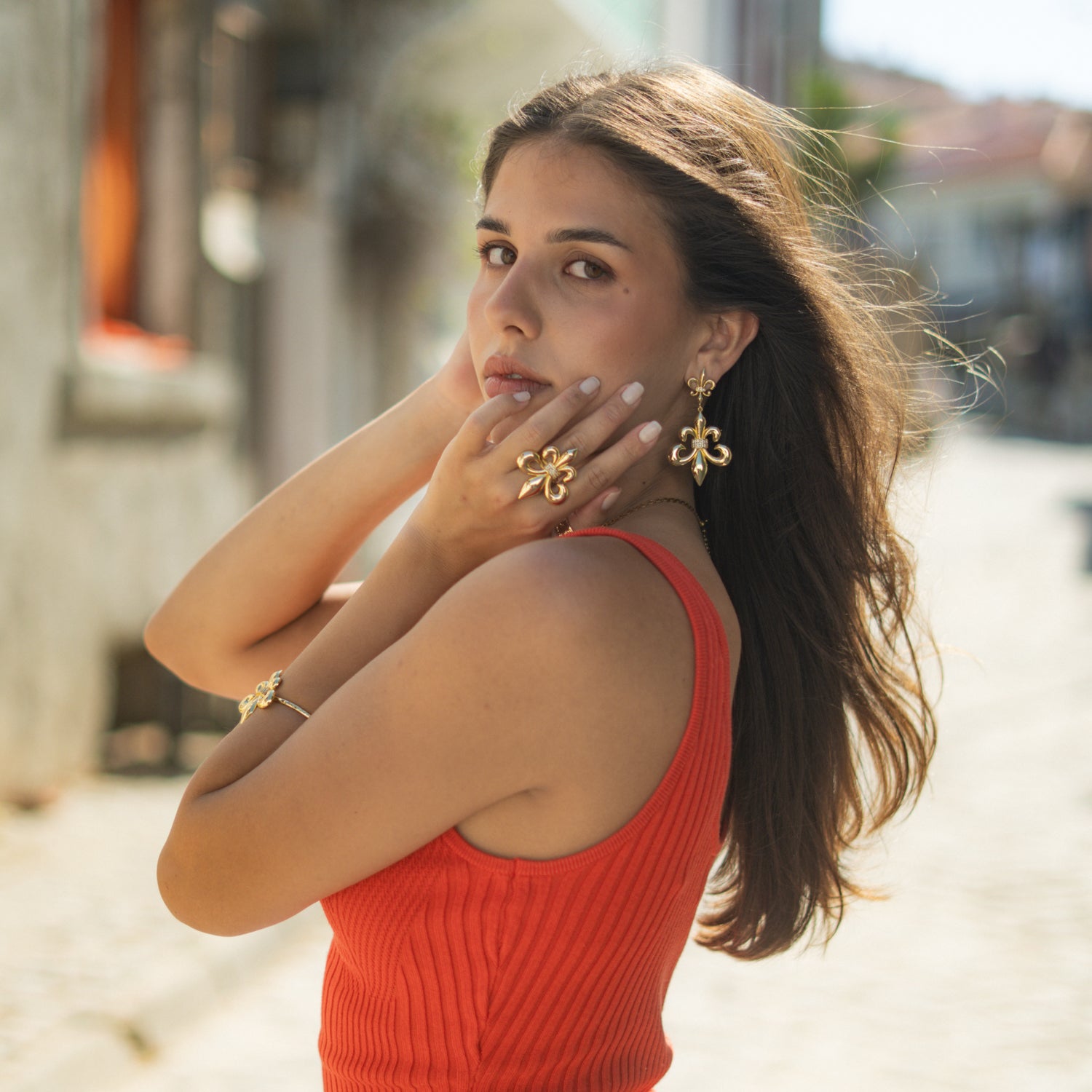 Royal Fleur de Lis Gold Statement Ring styled on finger, highlighting the polished gold finish