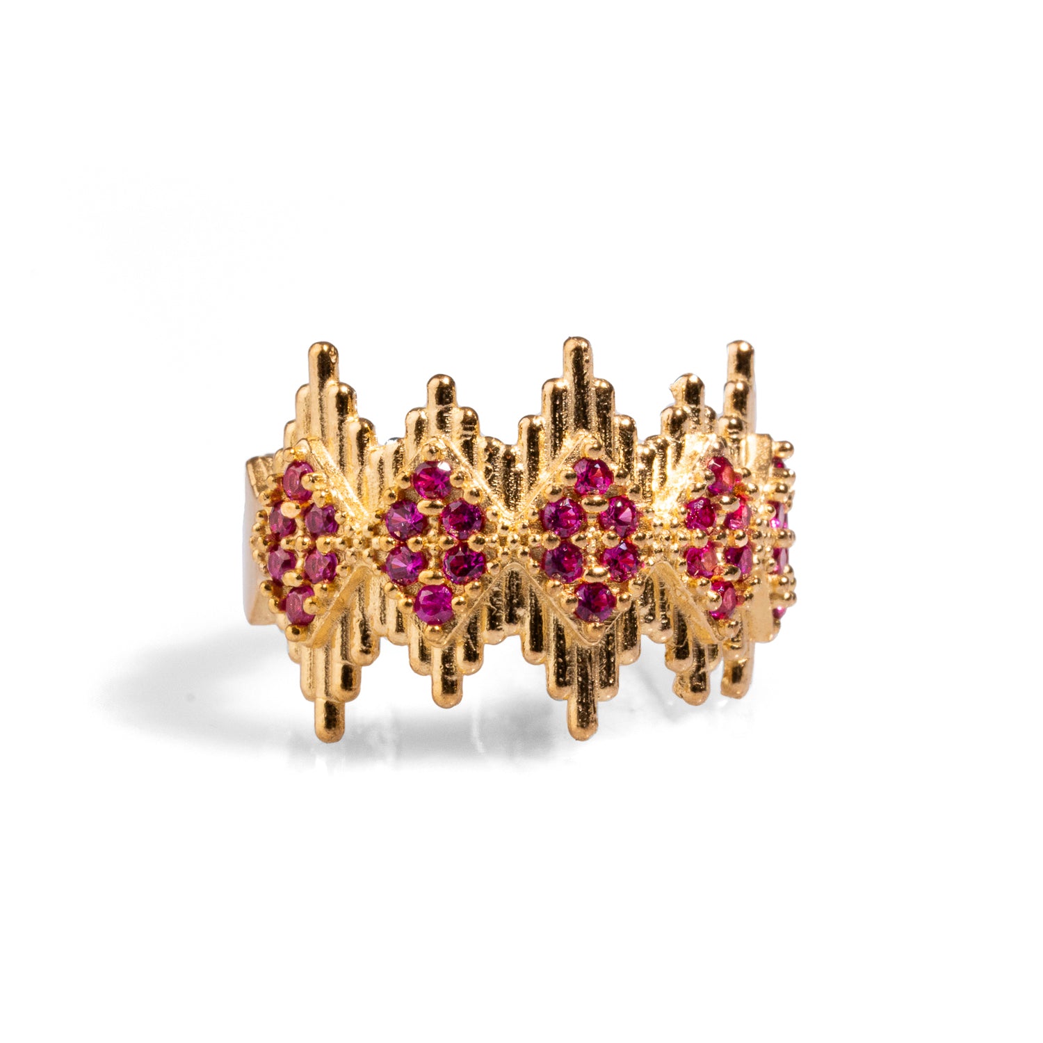 Luxurious 24k gold-plated statement ring featuring a crown-like geometric design adorned with ruby stones, with an adjustable band for a perfect fit.
