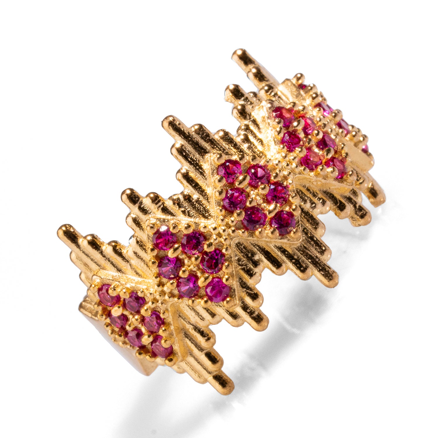 Regal statement ring featuring ruby stones and a crown-like gold design, crafted from 24k gold-plated brass with an adjustable band for a customizable fit.
