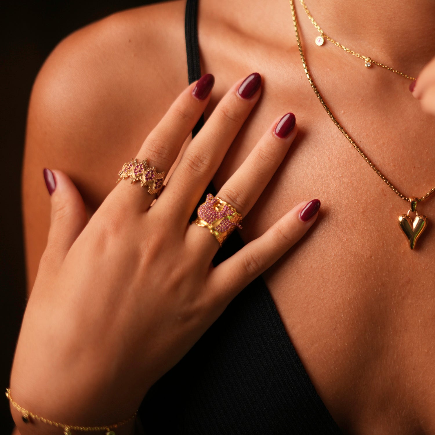 Elegant adjustable ring with a gold crown design and ruby stones, crafted from 24k gold-plated brass for a regal and striking look.
