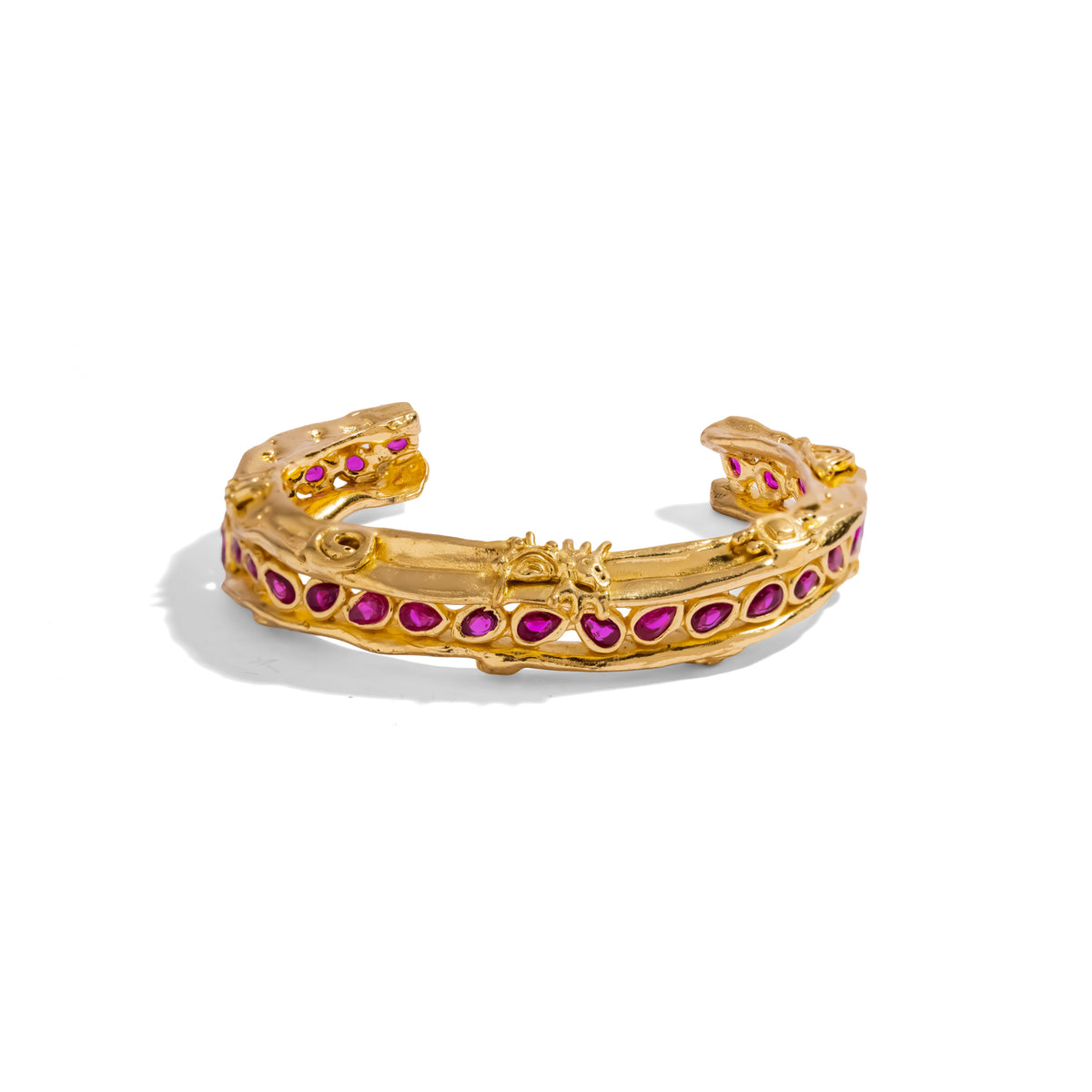 Side view of the Ruby Teardrop Antique Anatolian Symbols Gold Cuff Bracelet showing the open back and the sculpted ends
